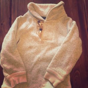 Cream sweater with tooth detail buttons